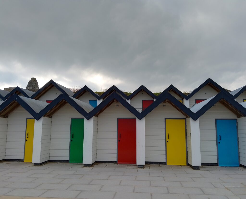 Beach huts in Swanage on a grey day